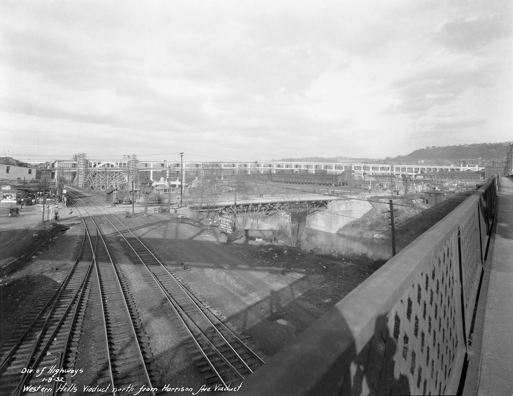 Photo of CH&D railroad tracks with the Western Hills Viaduct under construction in 1932