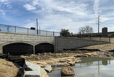 Pond with pond outfall in the background