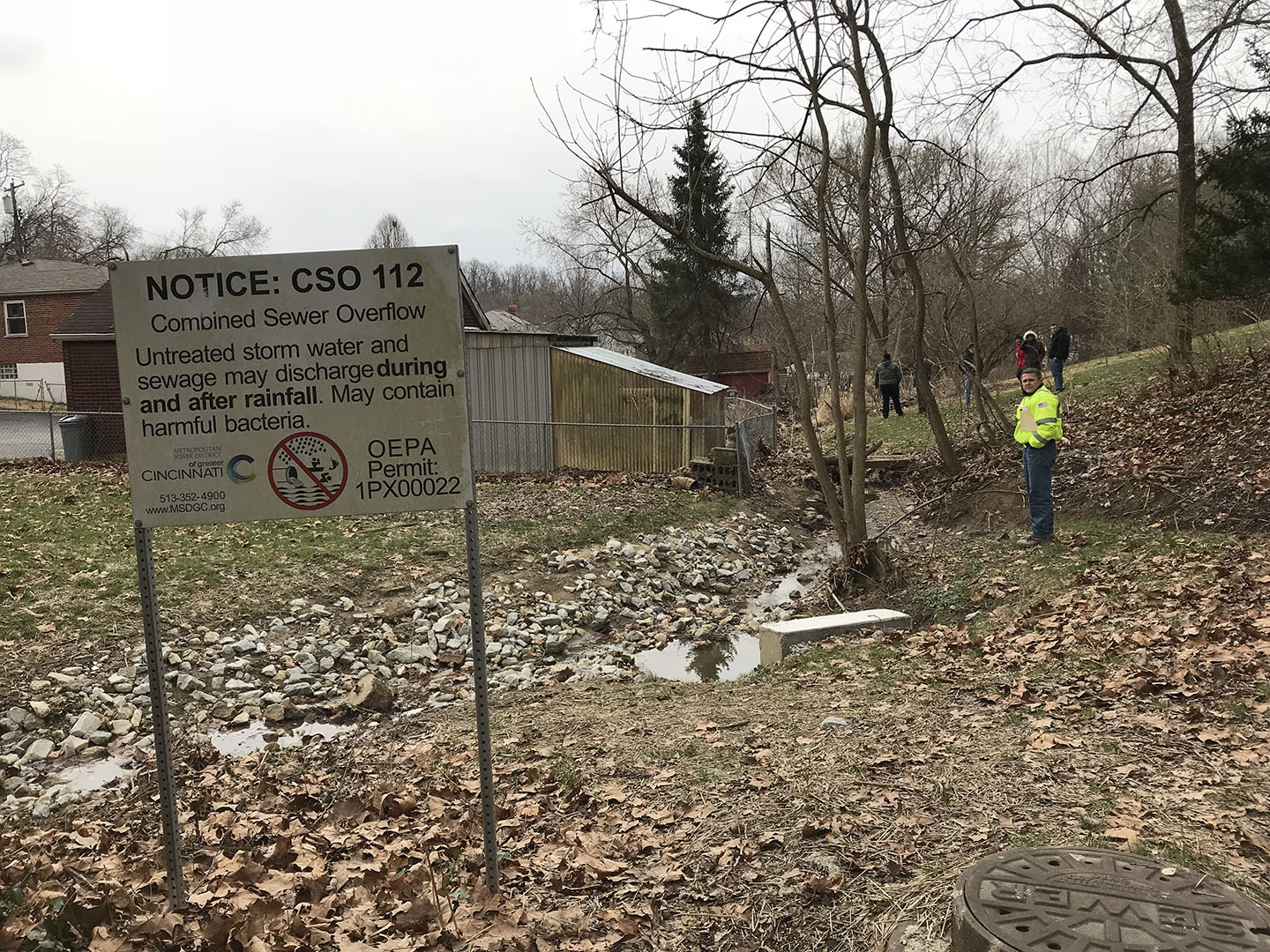 Photo of the CSO 5 outfall sign on the Mill Creek (wiht the Ohio EPA permit number)